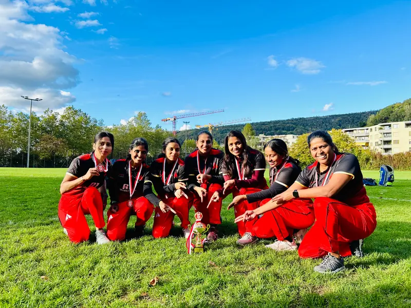 The A1 Women team with their medals on the grass after a match